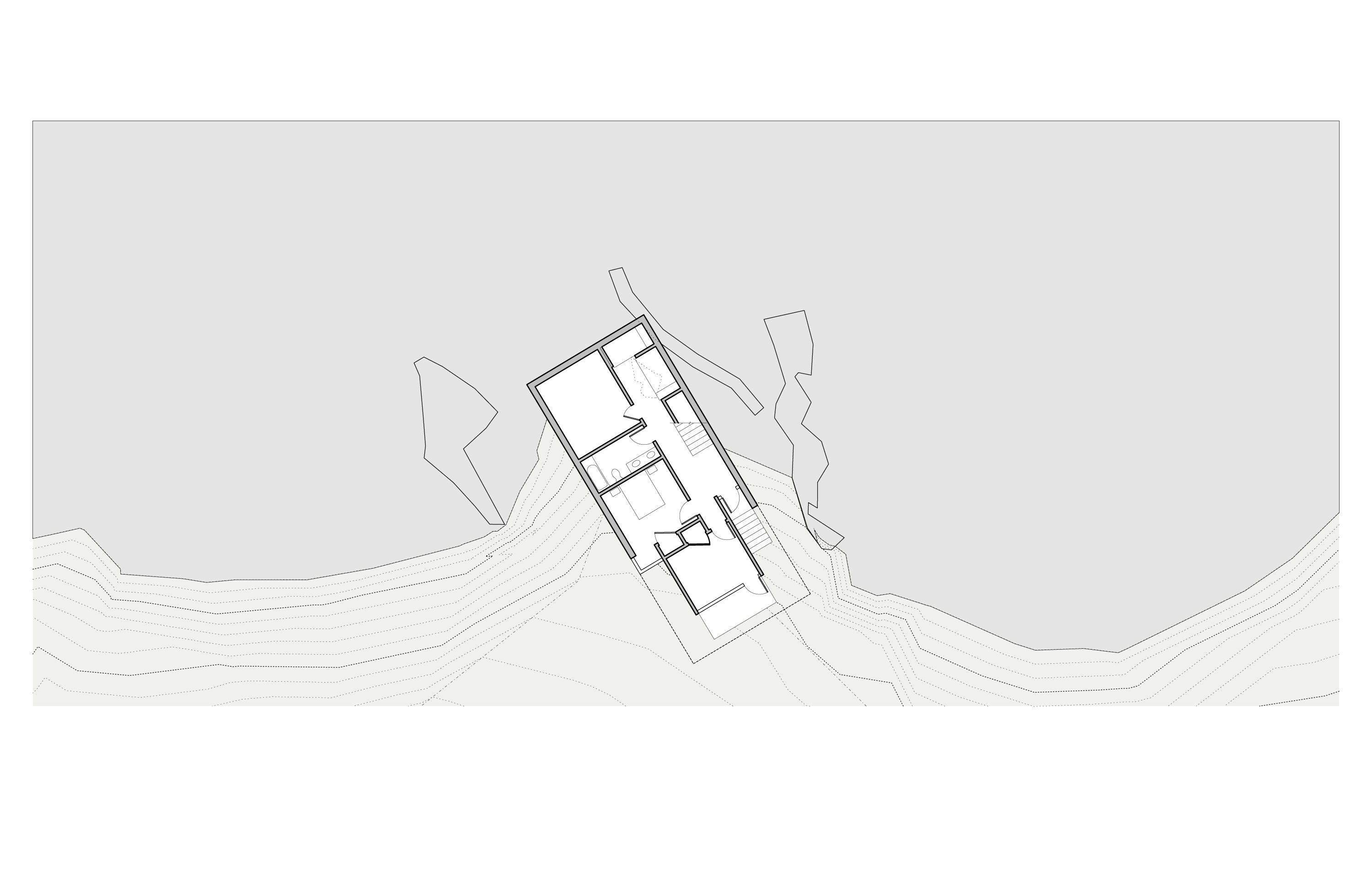 Lower level plan: a small rectangular volume tucked into a notch in the hillside, oriented diagonally on the page with topographic contours falling away to the south; boulder massing drawn as zigzag closed shapes flanks the building on each side; the plateau above is shown as the lighter field at top
