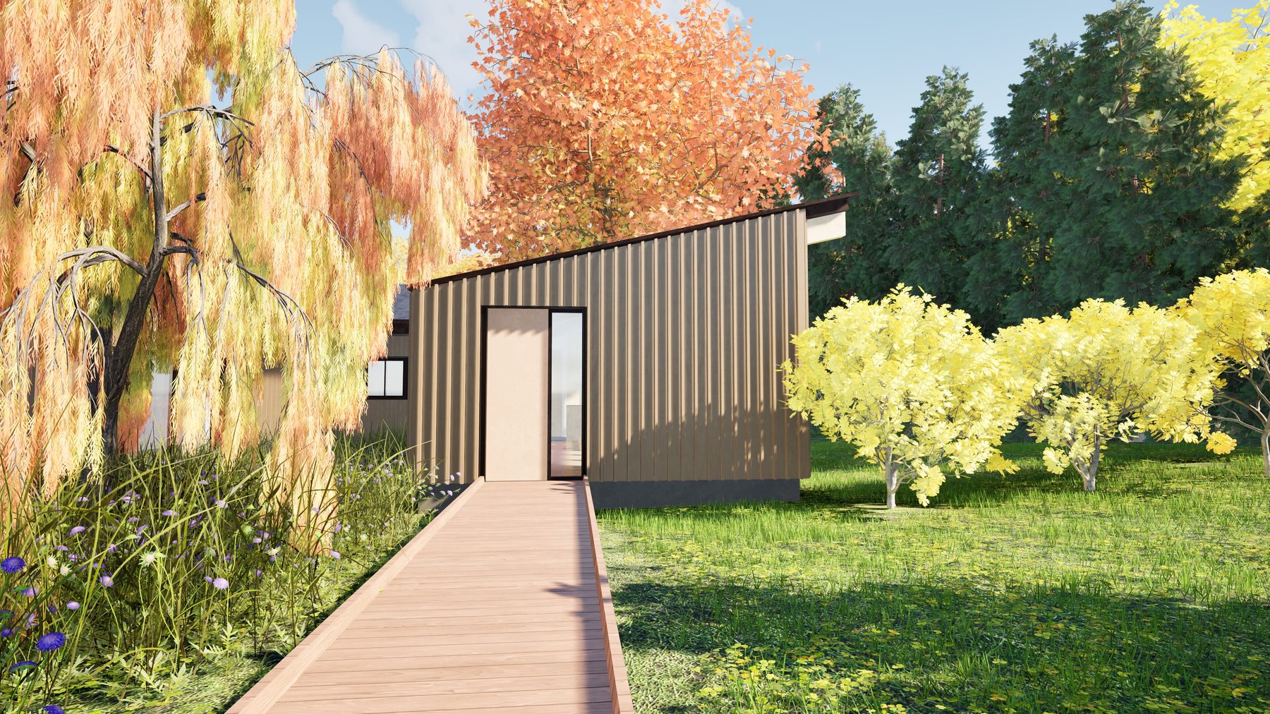 A wood walkway approaching the ADU pavilion through the meadow, with autumn trees framing the view