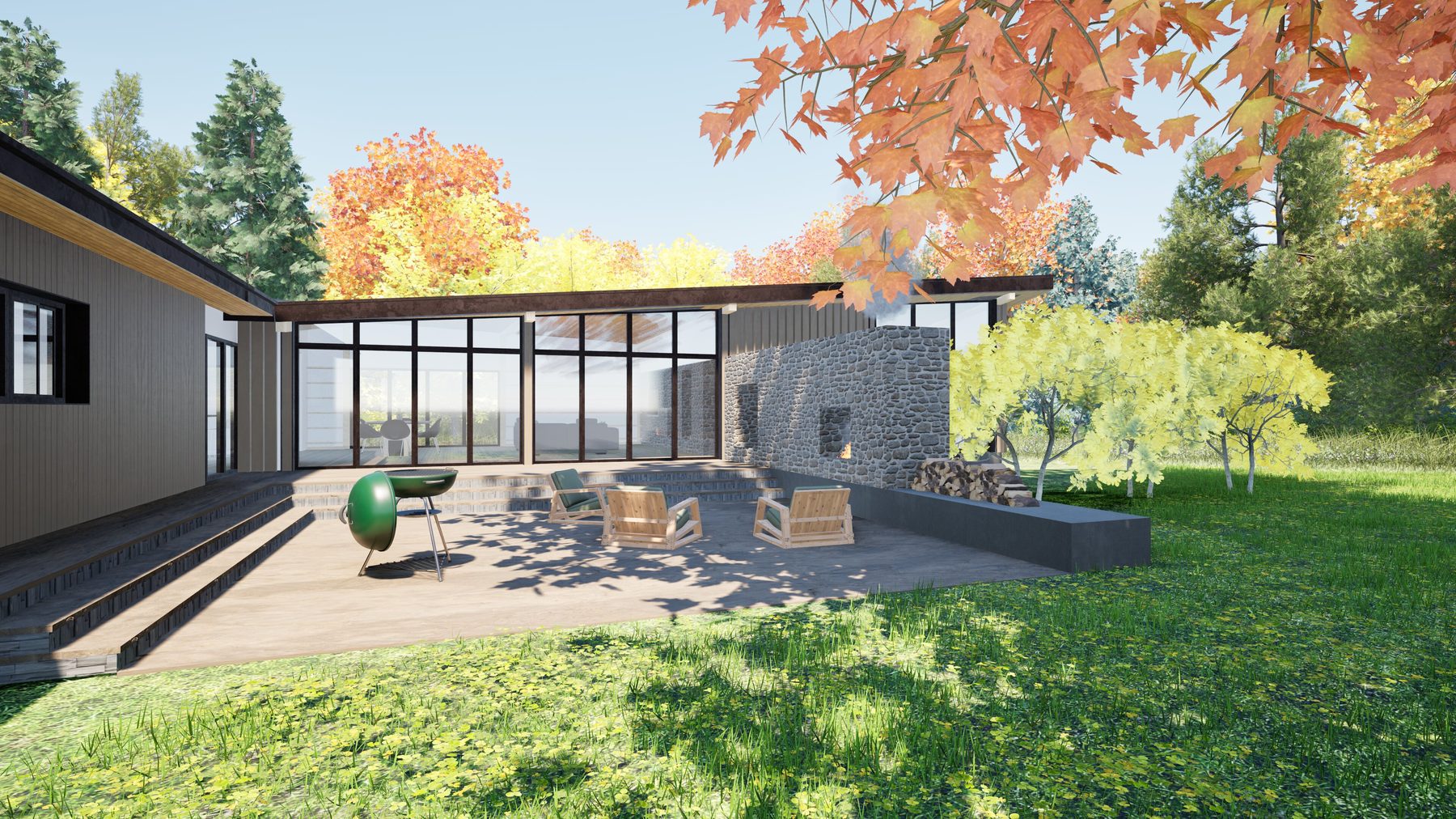 The terrace seen from the rear of the lot, with the stone wall, fireplace, and the new wing's glazing visible through autumn trees