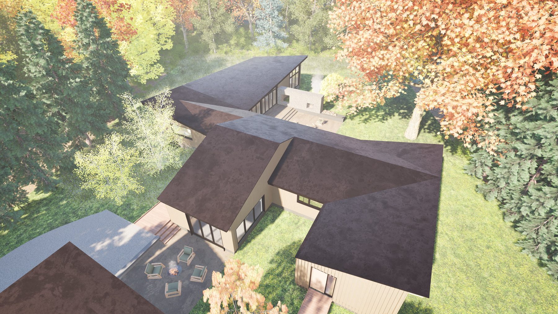 Aerial view of the renovated house and ADU pavilion sitting in the wooded lot
