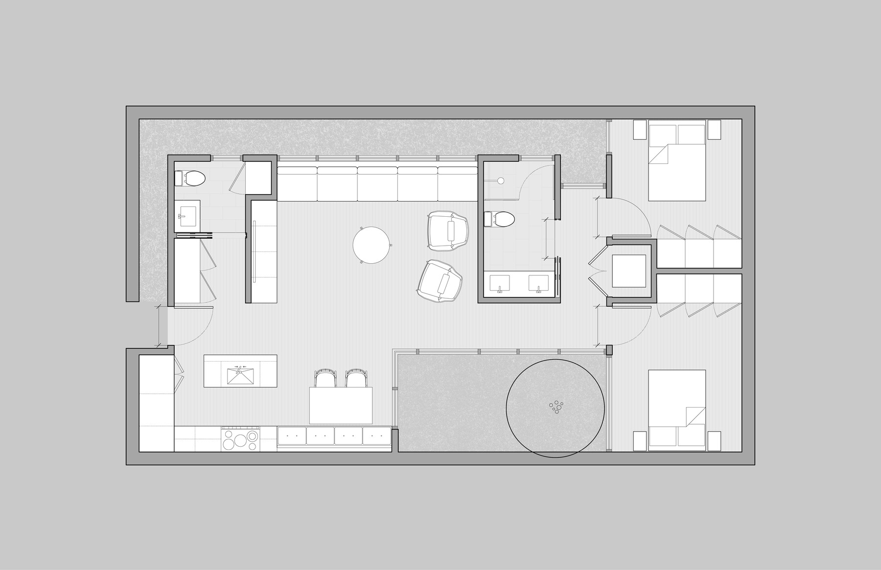 Floor plan of the ADU, showing two interior courtyards flanking a central great room with kitchen, dining, and living, a bathroom buffering two bedrooms at one end, and a utility room and entry at the other