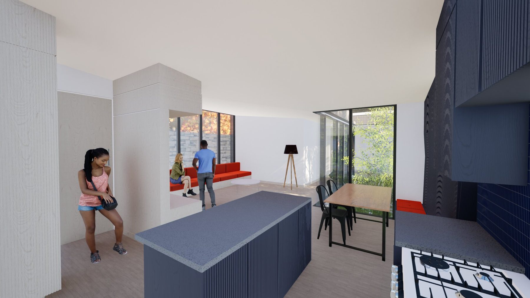 View from the kitchen island looking back through the great room toward a seating alcove and the second courtyard beyond